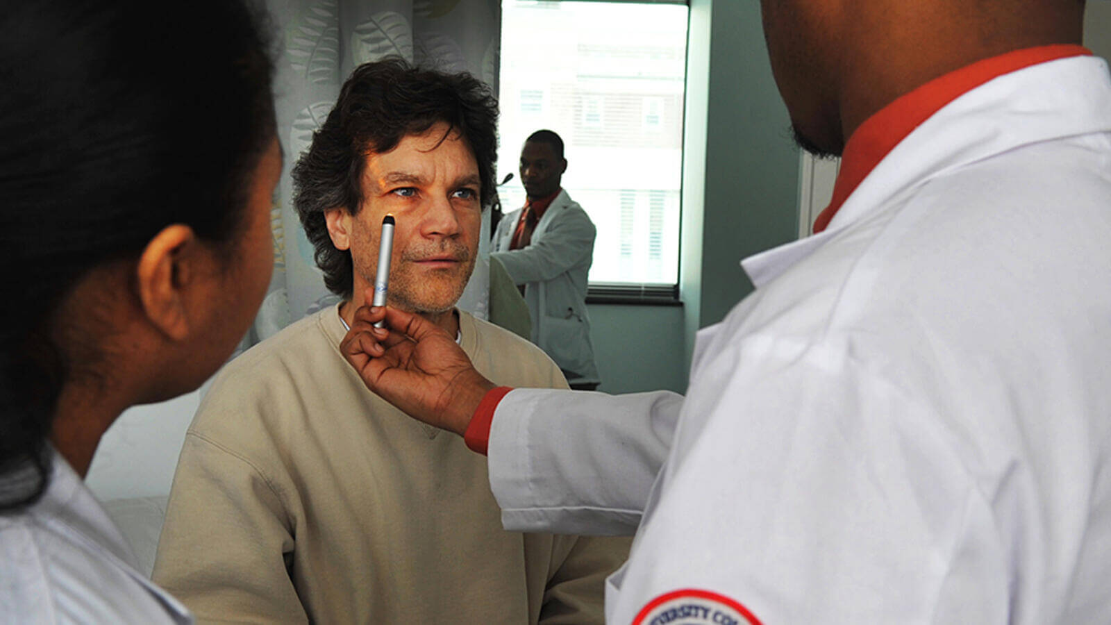 Patient taking a light test eye exam 